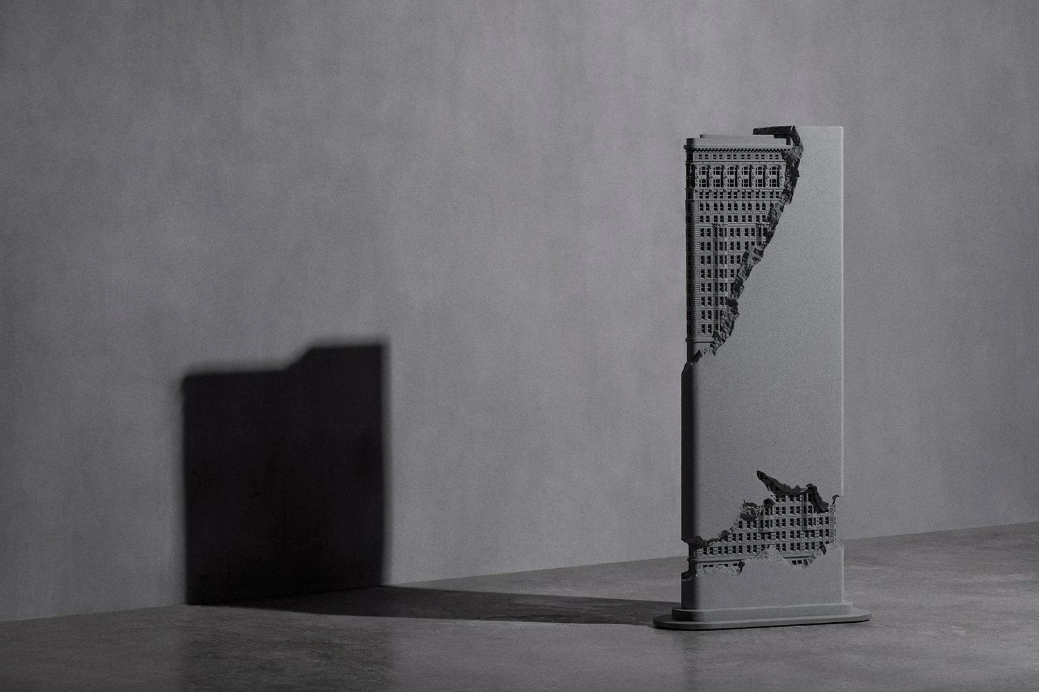 TheSoloist. architectural speaker and its shadow against a concrete wall