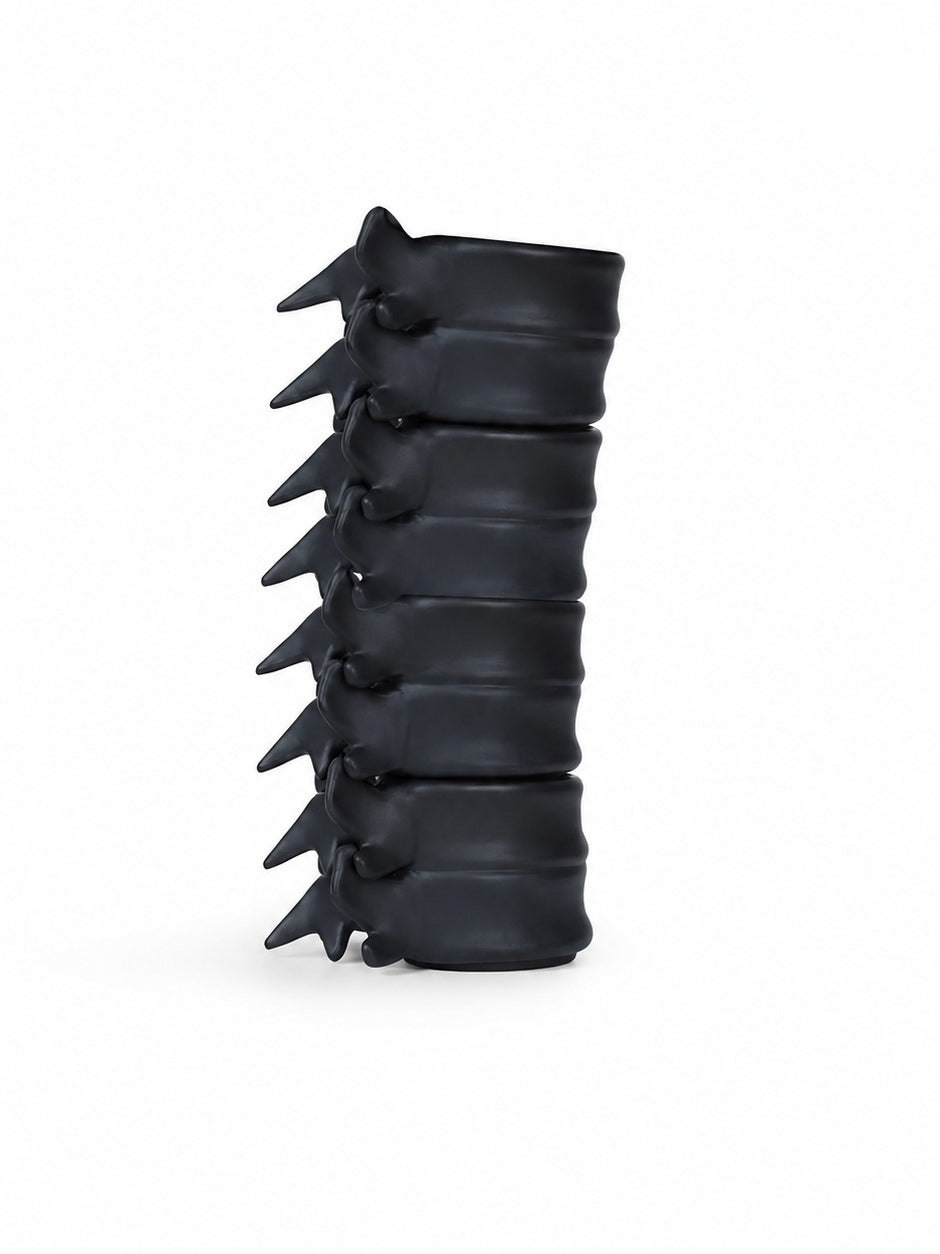 Four Black Porcelain Spine Cups stacked on white background
