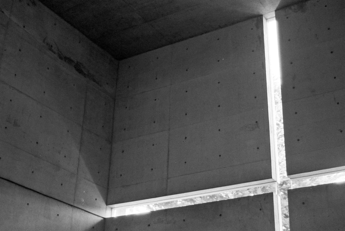 Real interior detail of the Church of the Light: a cross-shaped daylight opening and concrete wall joints, photographed by Chun-Hung Eric Cheng.