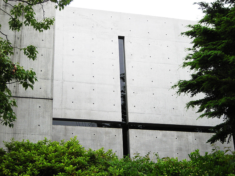 Exterior of Tadao Ando’s Church of the Light, showing concrete walls and the approach to the chapel.