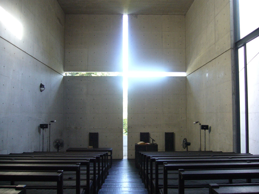 Real interior of Tadao Ando’s Church of the Light, with a luminous cross beyond the pews.