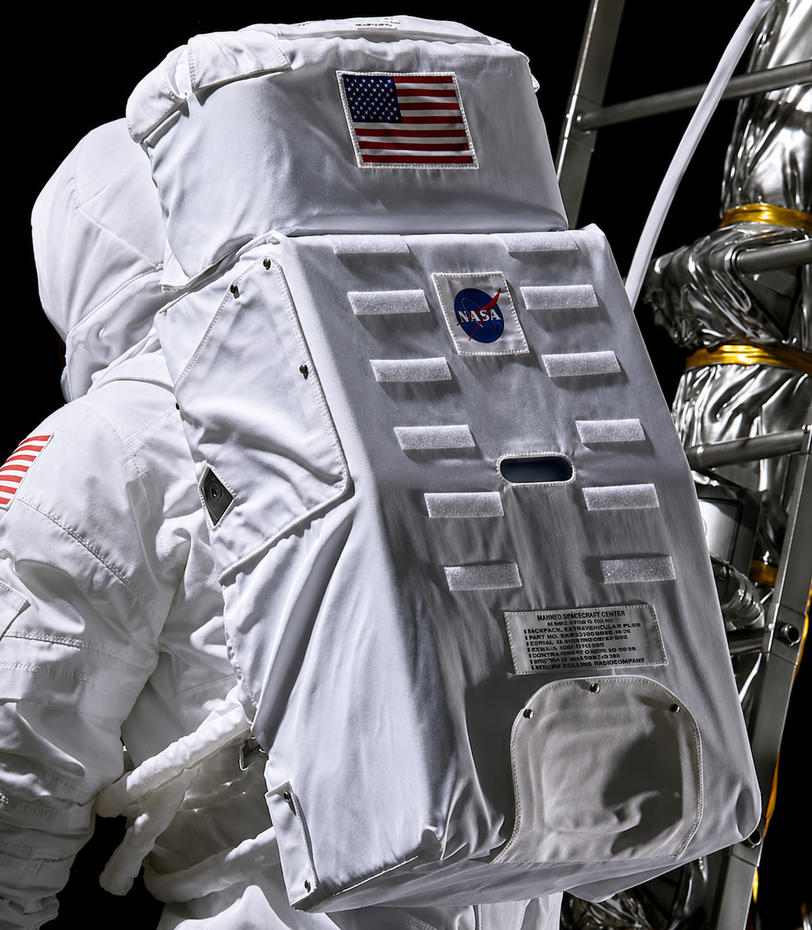 Rear detail of the Portable Life Support System backpack with flag, Velcro areas, labels, and ladder.